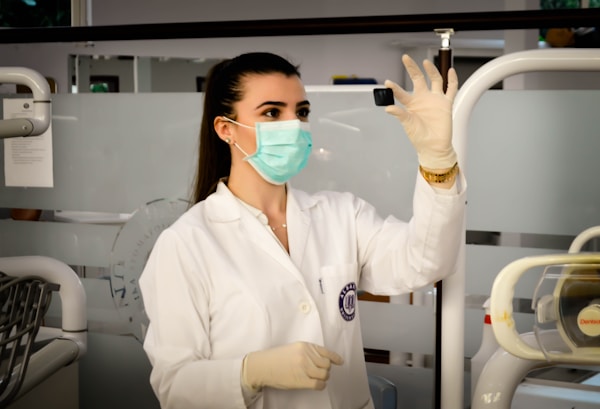 Healthcare professional preparing patient care equipment